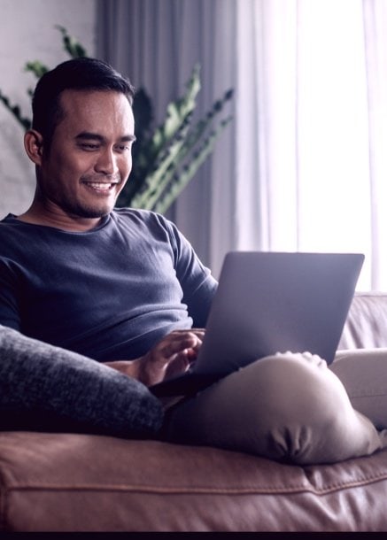 man researching Business Crypto Banking on computer